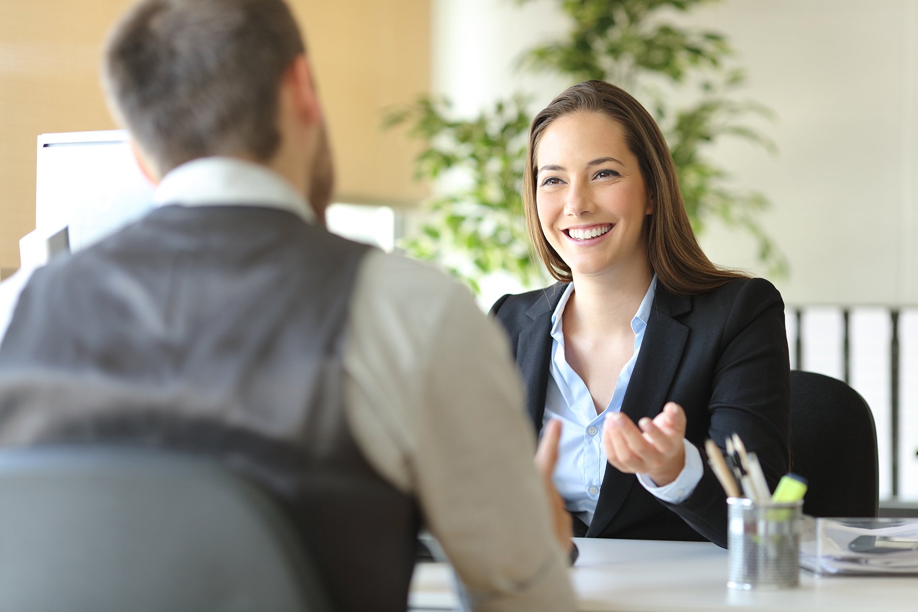 People smiling during a business transaction